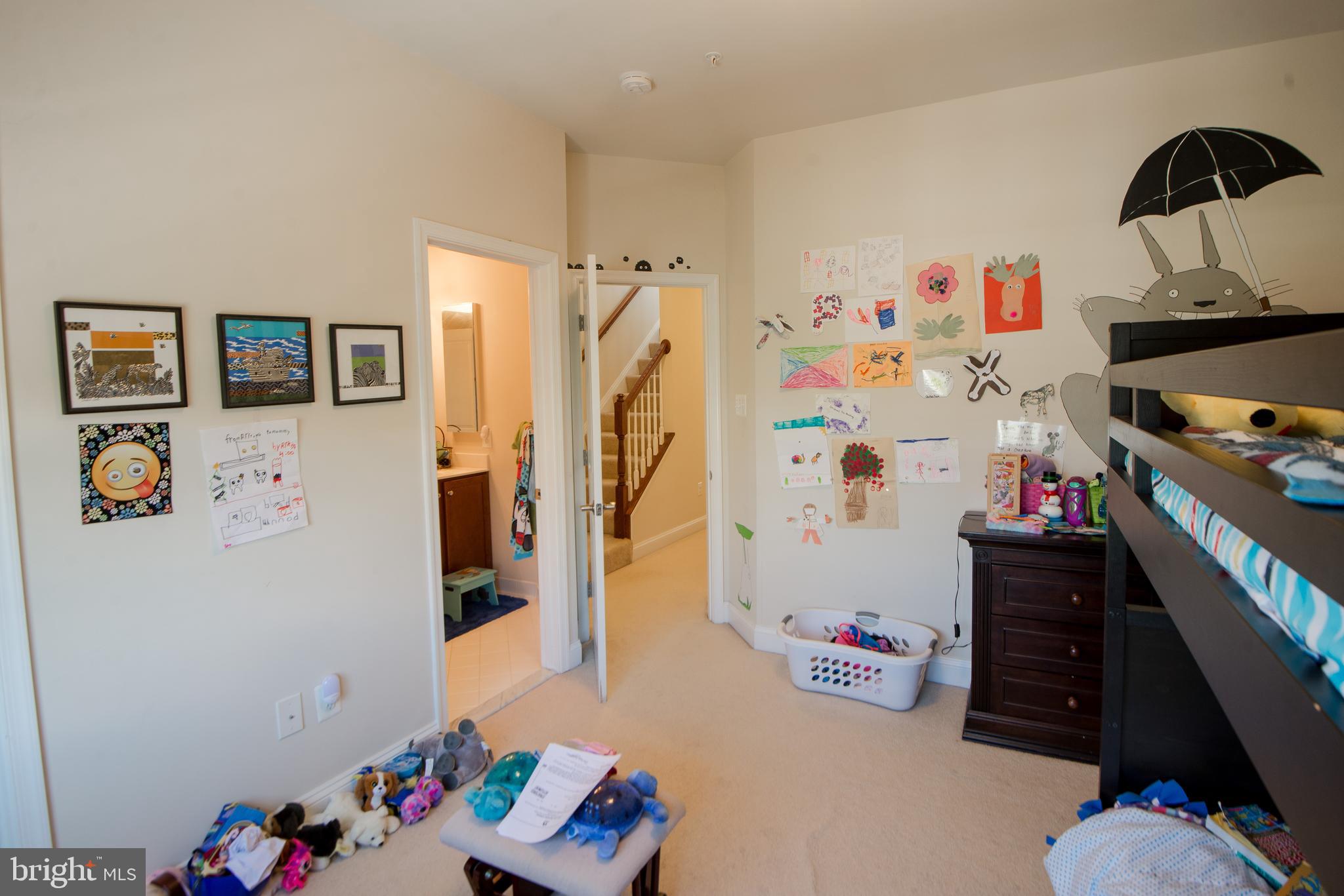 8 Meridian Lane Towson, MD 21286 - Photo 22 of 39 a room with a refrigerator and a couch