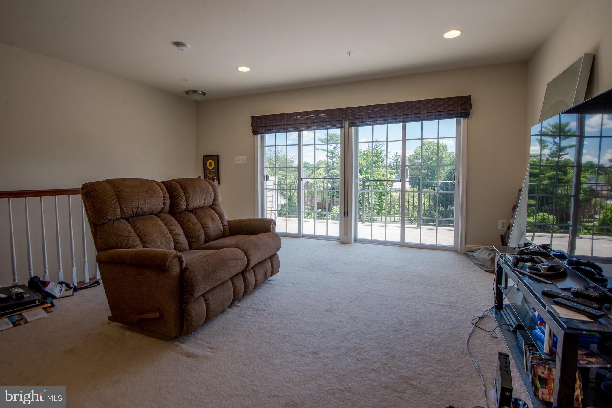 8 Meridian Lane Towson, MD 21286 - Photo 25 of 39 a living room with furniture and a floor to ceiling window