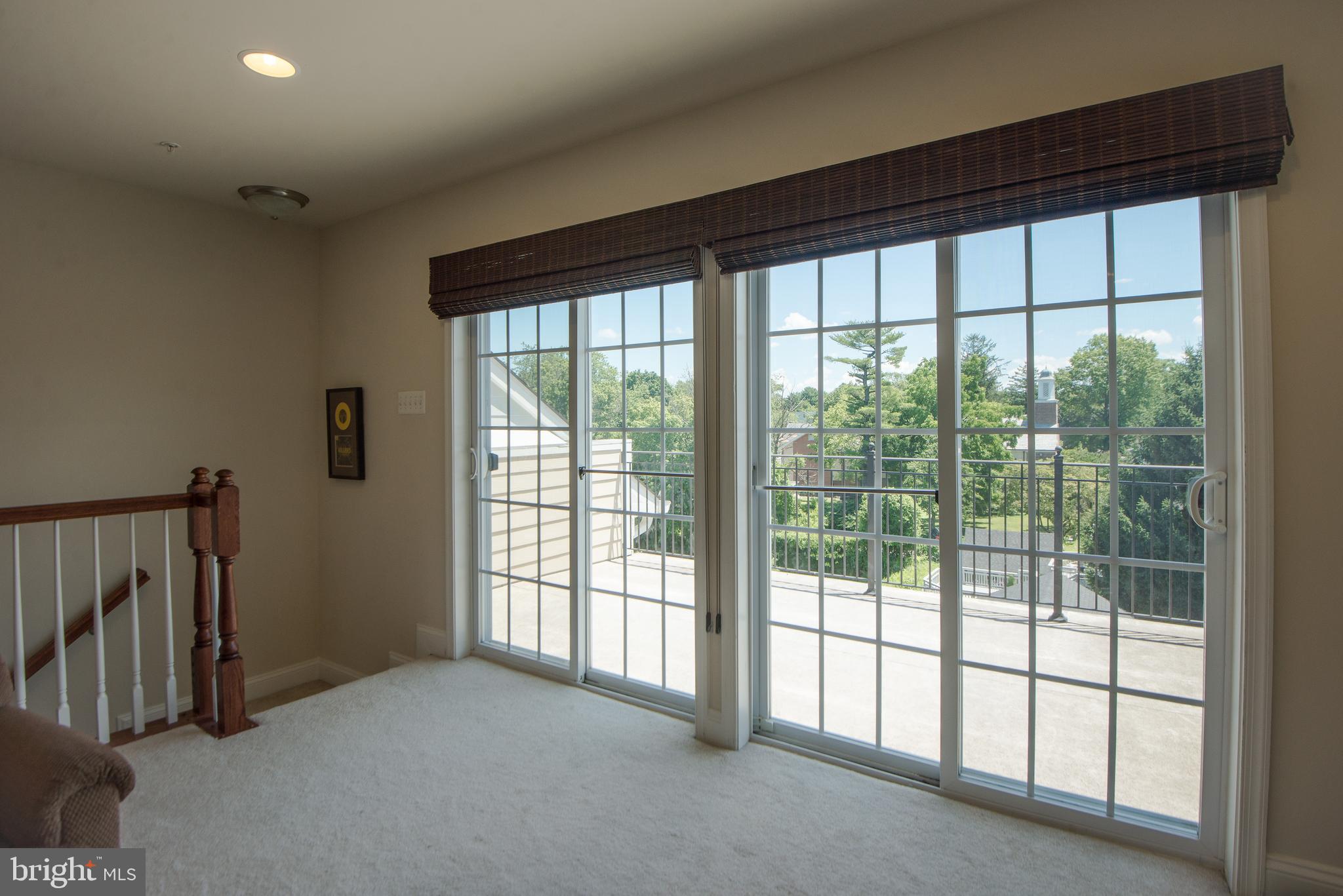 8 Meridian Lane Towson, MD 21286 - Photo 26 of 39 a view of empty room with large windows