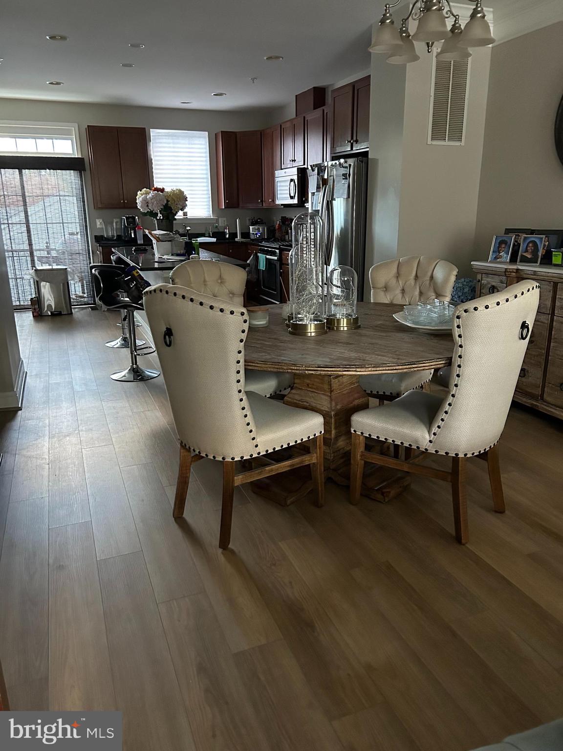 8 Meridian Lane Towson, MD 21286 - Photo 4 of 39 a view of a dining room with furniture window and wooden floor