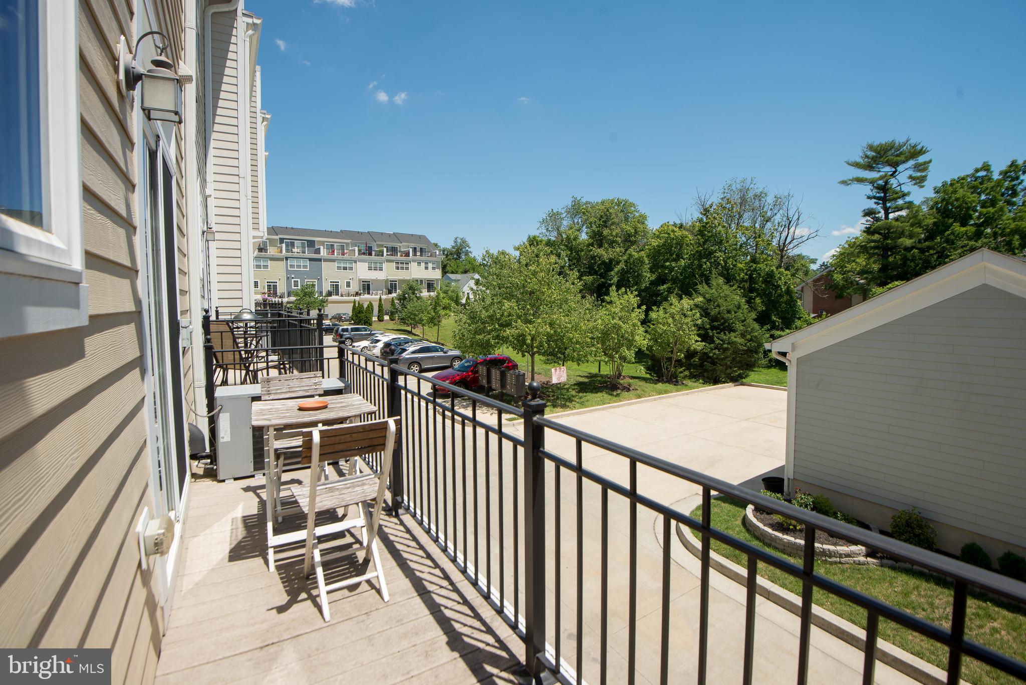 8 Meridian Lane Towson, MD 21286 - Photo 8 of 39 a balcony view with two chairs and a table