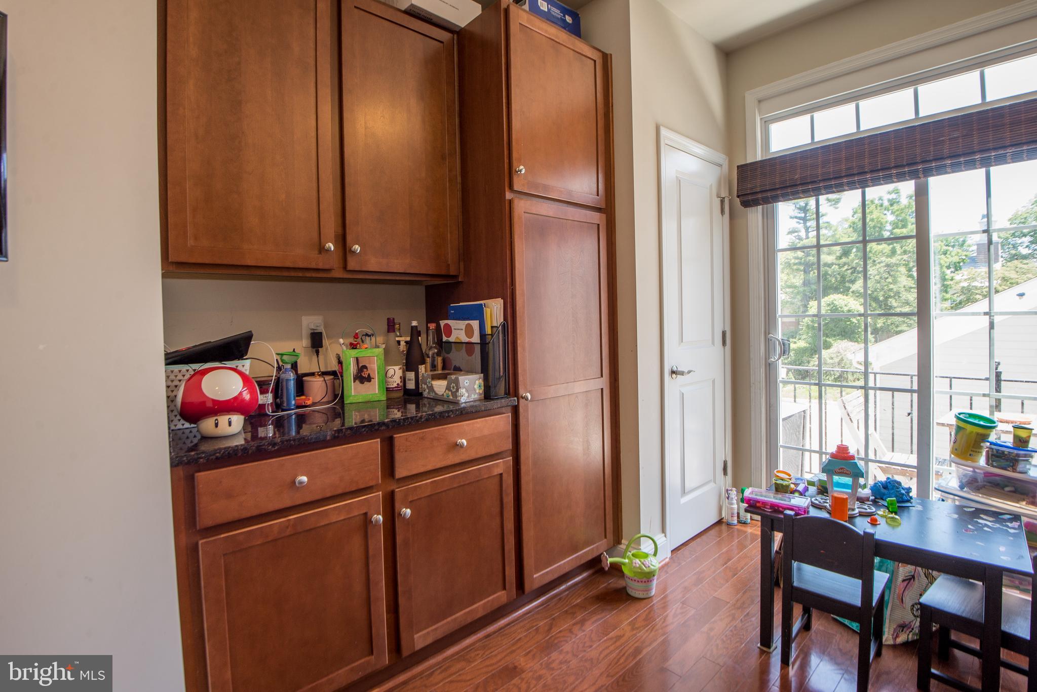 8 Meridian Lane Towson, MD 21286 - Photo 9 of 39 a kitchen with stainless steel appliances granite countertop a refrigerator sink dining table and chairs