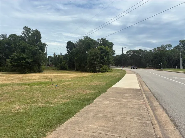 a view of swimming pool with seating in background