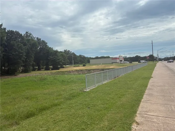 a view of a lake with a big yard