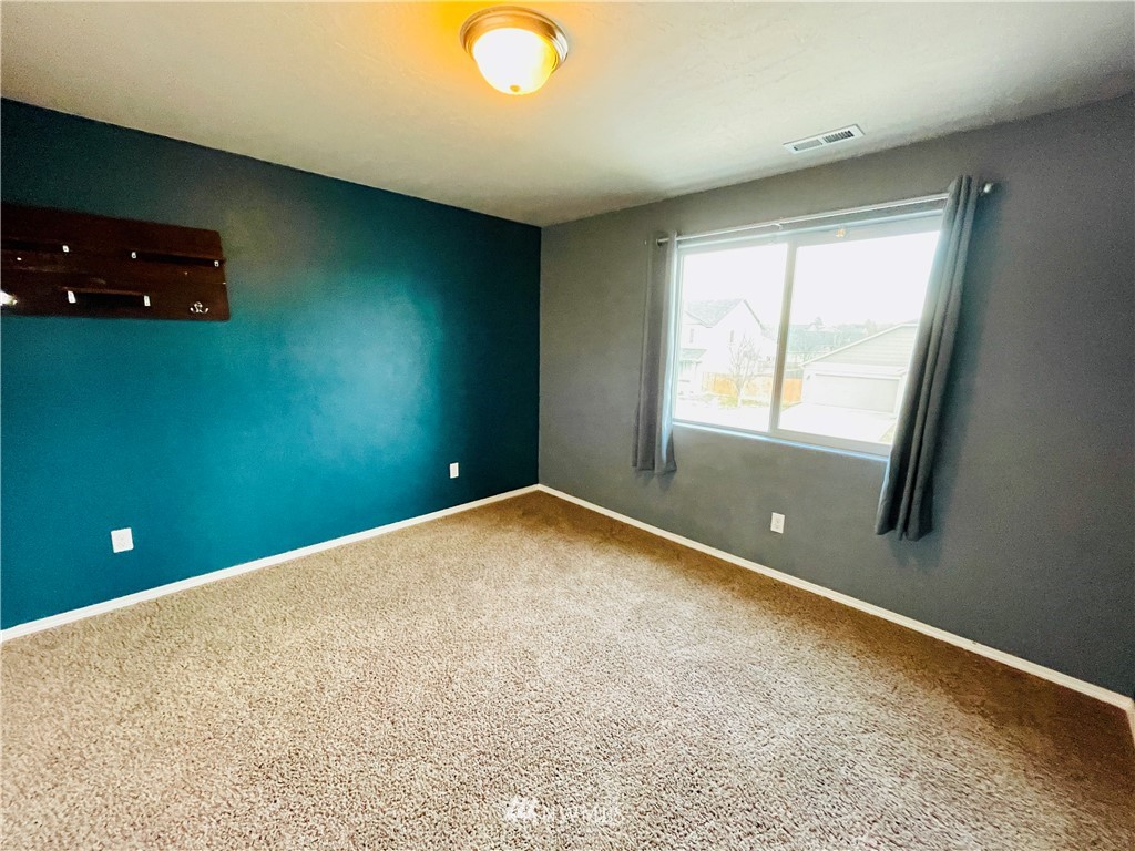 1924 Stevens Street Walla Walla, WA 99362 - Photo 16 of 24 a view of an empty room with a window