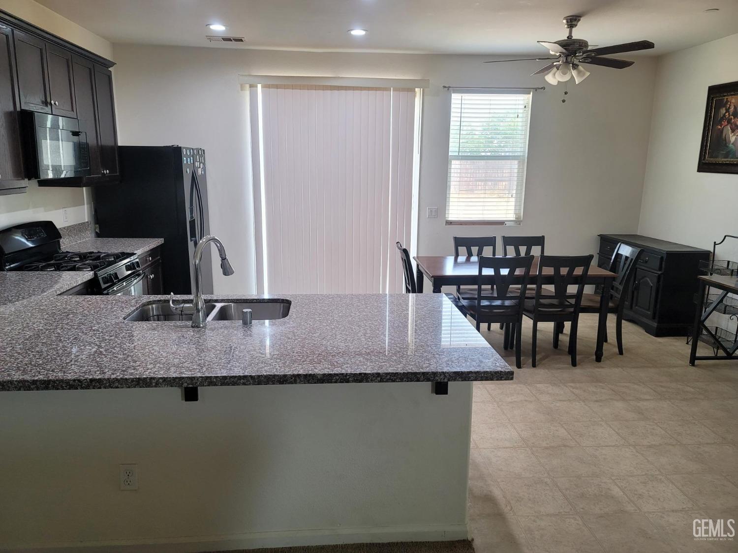 Undisclosed Address Arvin, CA 93203 - Photo 4 of 7 a view of a dining room with furniture
