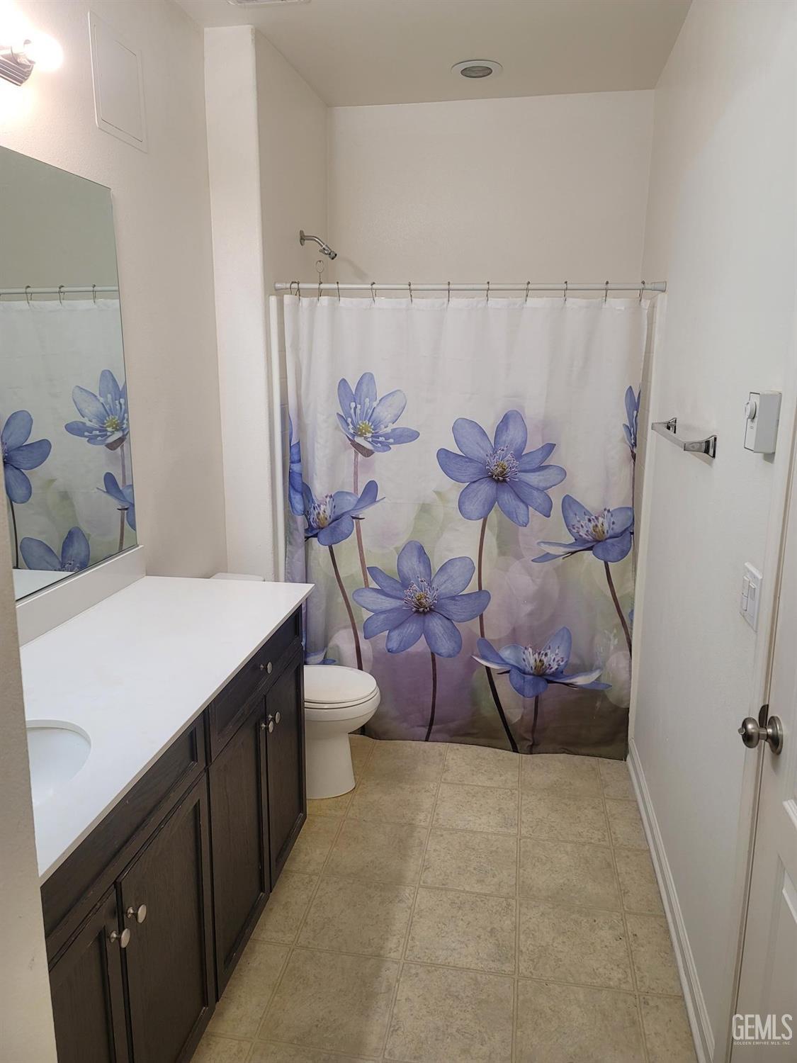Undisclosed Address Arvin, CA 93203 - Photo 6 of 7 a spacious bathroom with a table and a shower