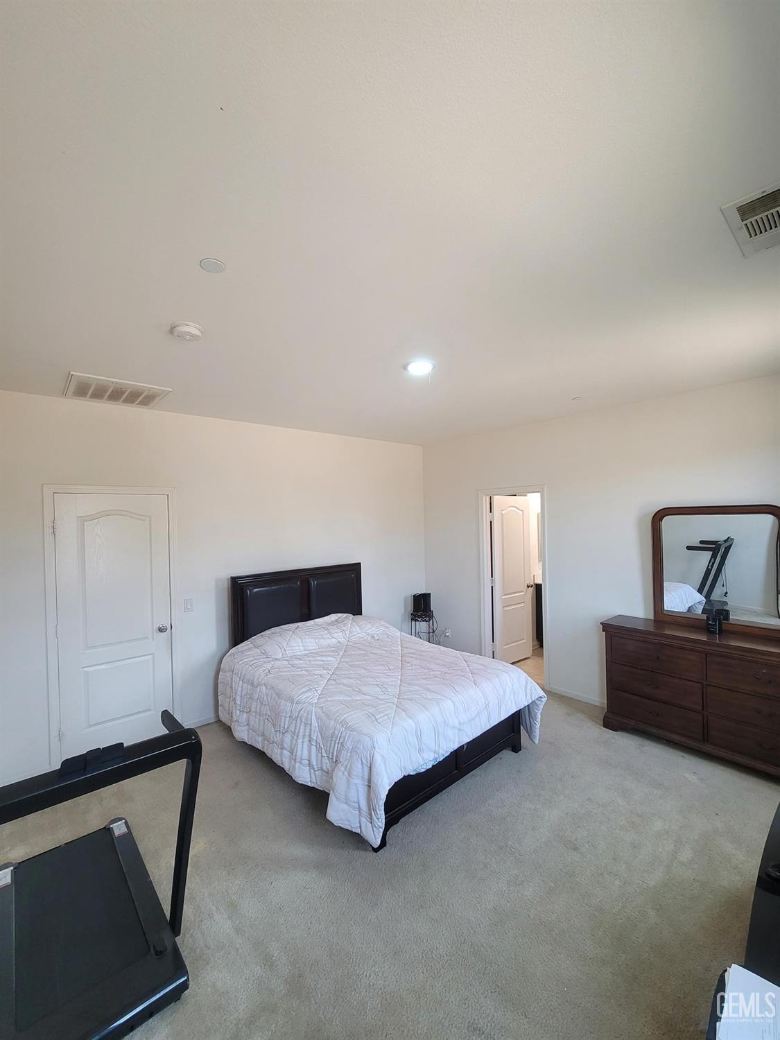 Undisclosed Address Arvin, CA 93203 - Photo 7 of 7 a spacious bedroom with a bed and dresser