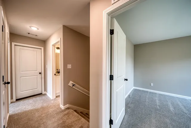 a view of a bathroom with a shower and a sink