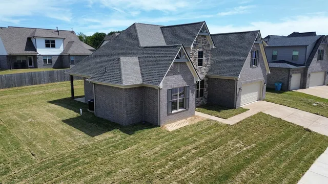 front view of a house with a yard