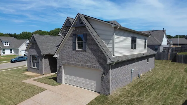 a view of house with yard