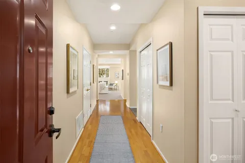 a kitchen with white cabinets and appliances