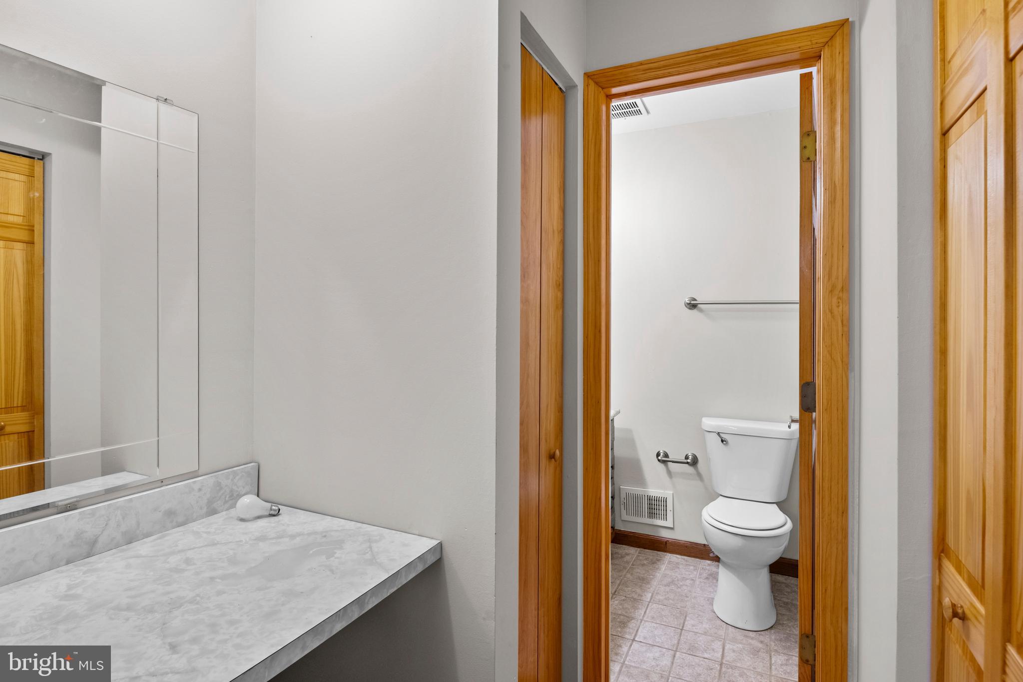 4903 Farming Ridge Boulevard Reading, PA 19606 - Photo 23 of 33 a bathroom with a granite countertop sink a toilet and a shower