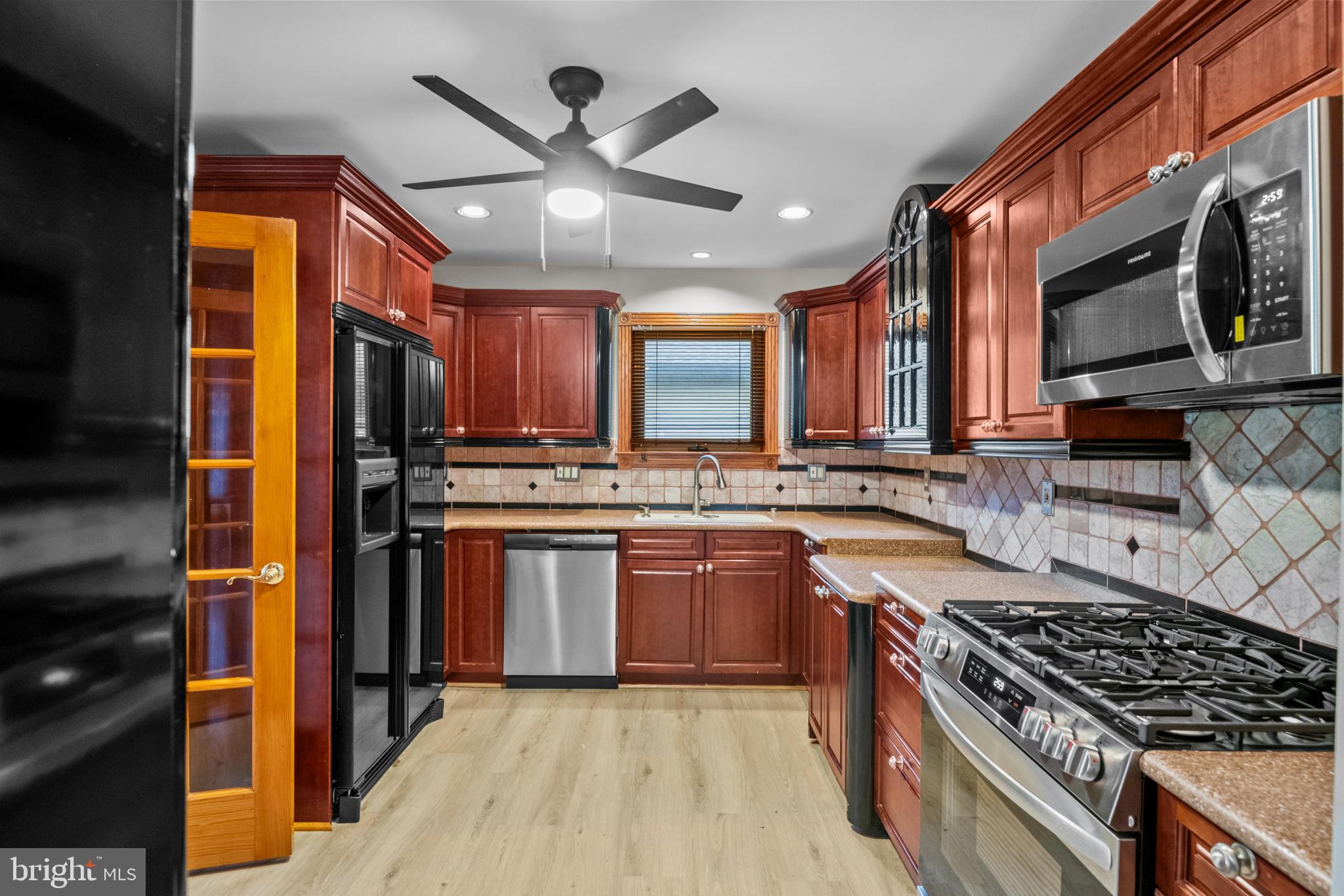 4903 Farming Ridge Boulevard Reading, PA 19606 - Photo 8 of 33 a kitchen with stainless steel appliances granite countertop a stove top oven a sink and dishwasher