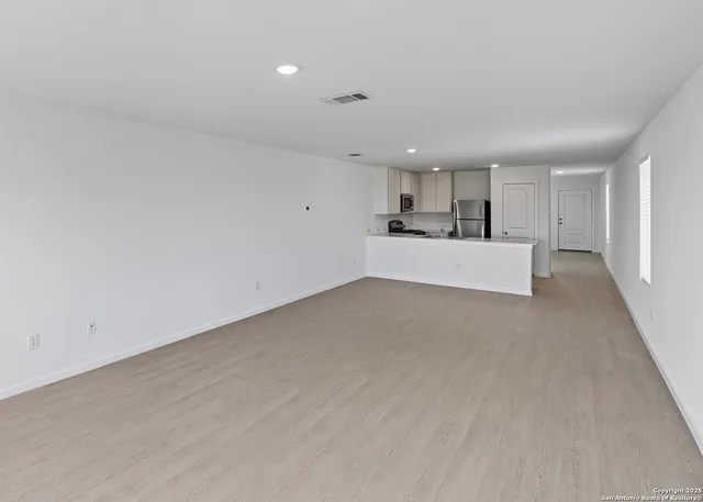 a view of a kitchen with a sink