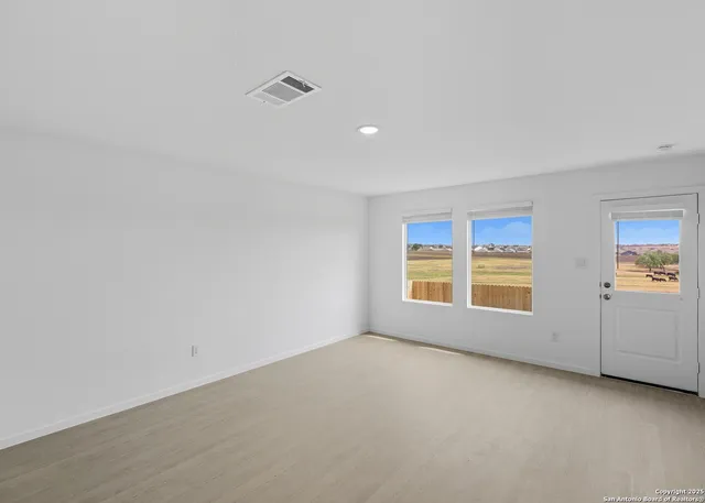 an empty room with windows