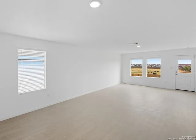 a kitchen with white cabinets stainless steel appliances and sink