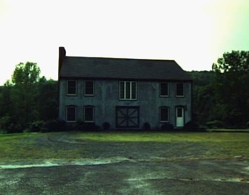 a view of house with yard
