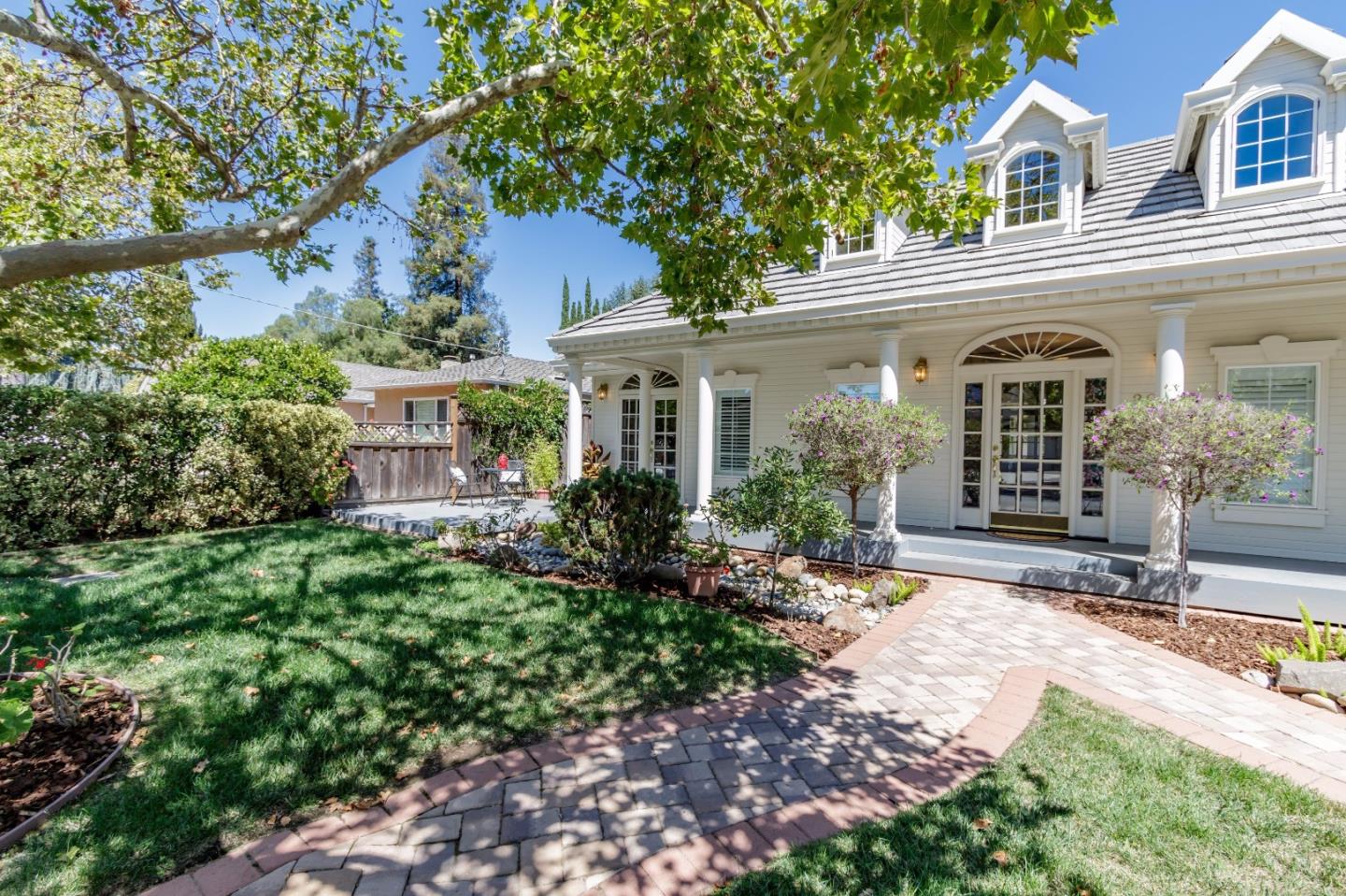 a front view of a house with garden