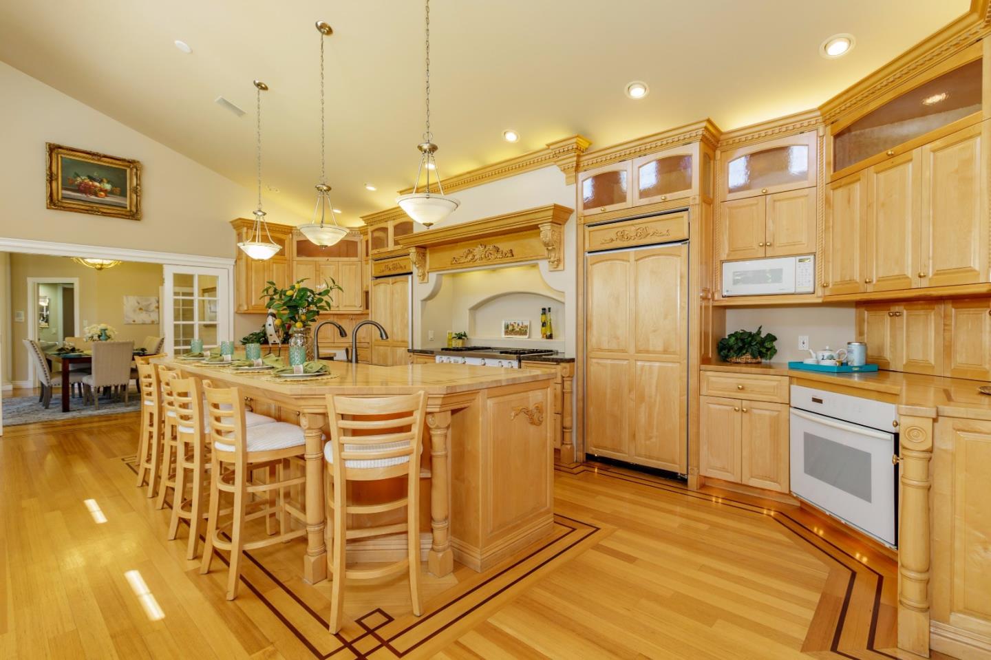 20585 Scofield Drive Cupertino, CA 95014 - Photo 12 of 32 a kitchen with kitchen island granite countertop a sink cabinets and stainless steel appliances