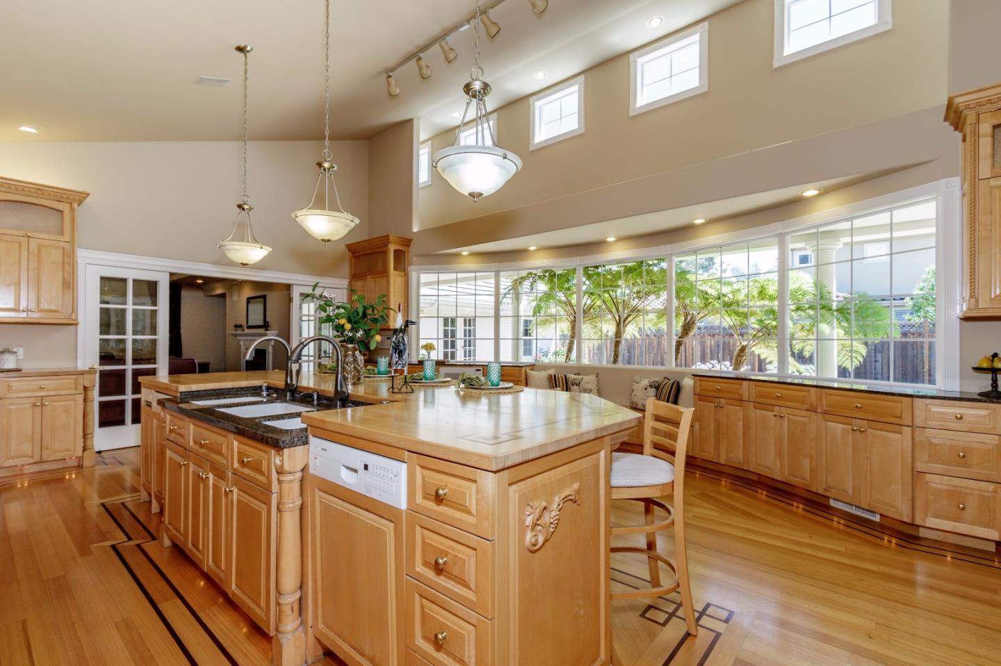 20585 Scofield Drive Cupertino, CA 95014 - Photo 16 of 32 a kitchen with stainless steel appliances granite countertop a sink stove and refrigerator