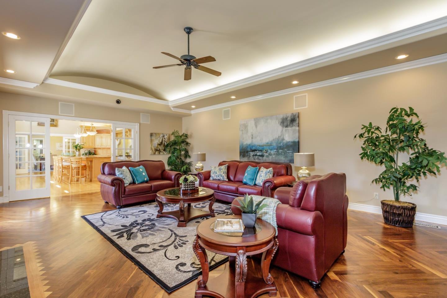 20585 Scofield Drive Cupertino, CA 95014 - Photo 17 of 32 a living room with furniture a chandelier and a potted plant