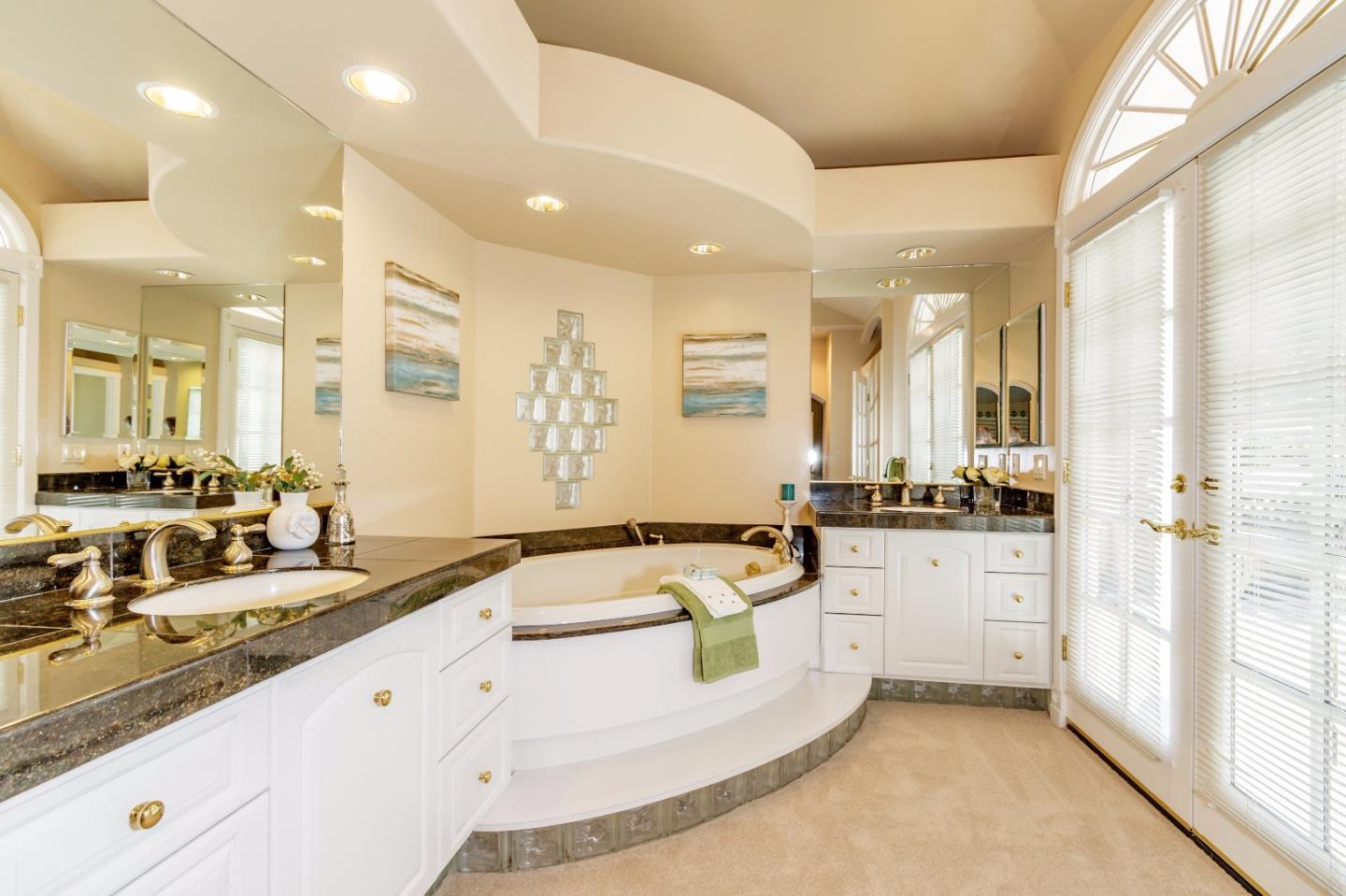 20585 Scofield Drive Cupertino, CA 95014 - Photo 22 of 32 a large white kitchen with granite countertop a sink and white cabinets