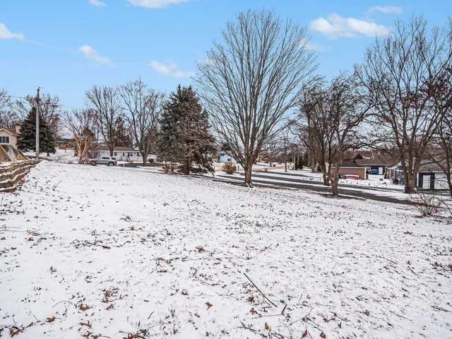 a view of snow on the side of the road