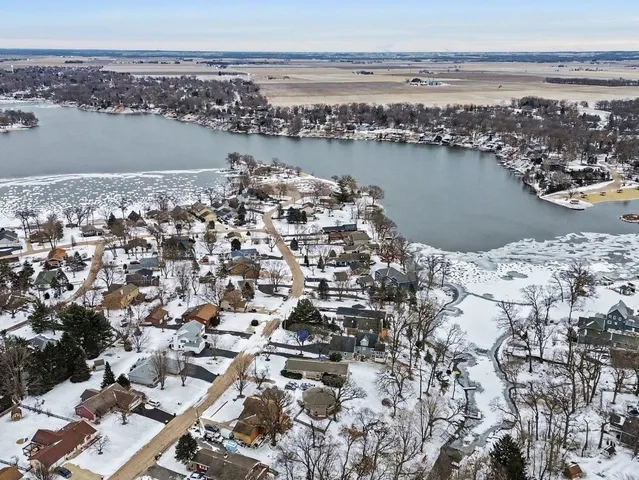 an aerial view of a houses with ocean view