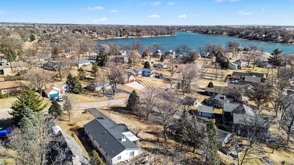 an aerial view of a house with outdoor space