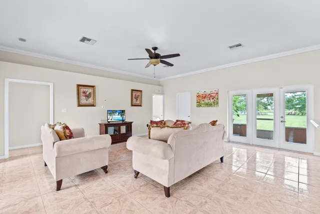 a kitchen with granite countertop white cabinets sink and stainless steel appliances