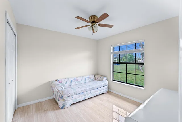 a spacious bathroom with a tub sink and mirror