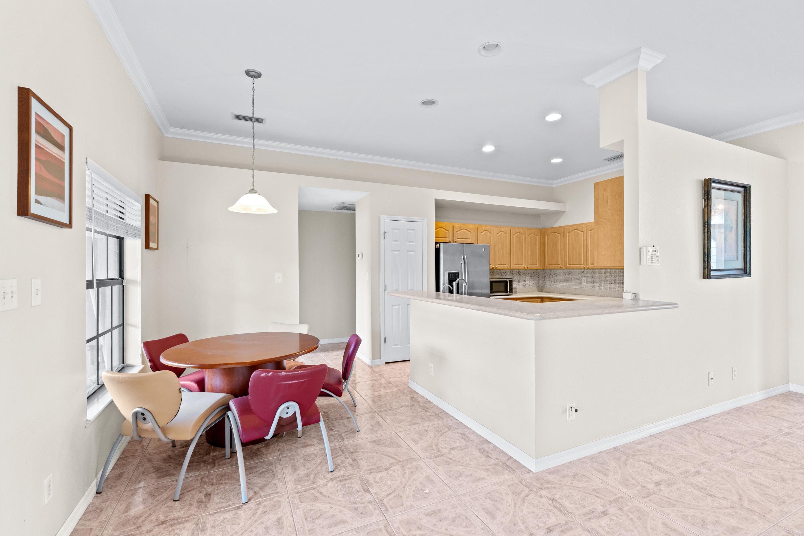 907 Sawgrass Street Clewiston, FL 33440 - Photo 45 of 60 a view of kitchen with cabinets and wooden floor