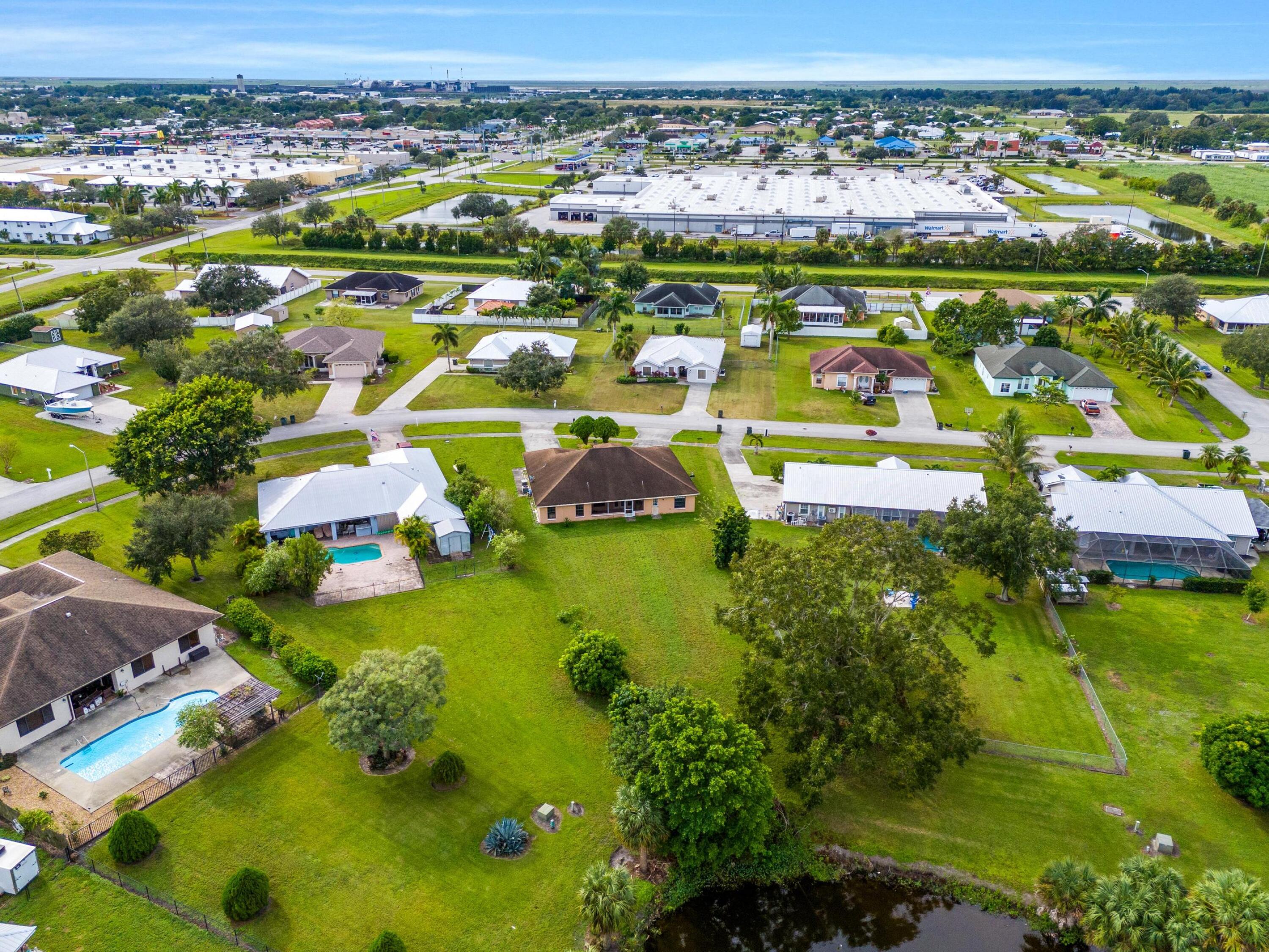 907 Sawgrass Street Clewiston, FL 33440 - Photo 5 of 60 an aerial view of residential houses with outdoor space
