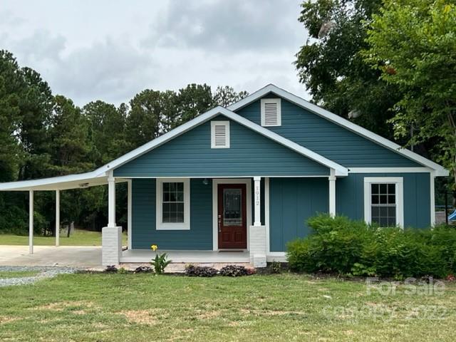 1912 Flat Creek Road Lancaster, SC 29720 - Photo 1 of 29 a front view of a house with a yard
