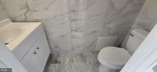 a bathroom with a sink and toilet