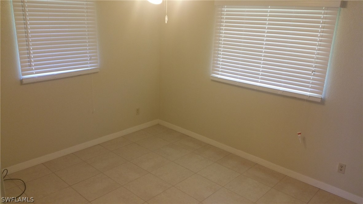 207 Jasmine Road West Lehigh Acres, FL 33936 - Photo 17 of 25 an empty room with a window