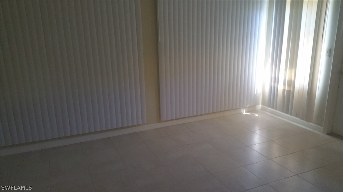 207 Jasmine Road West Lehigh Acres, FL 33936 - Photo 23 of 25 a view of a livingroom and window