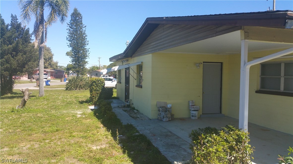 207 Jasmine Road West Lehigh Acres, FL 33936 - Photo 8 of 25 a view of back yard of the house