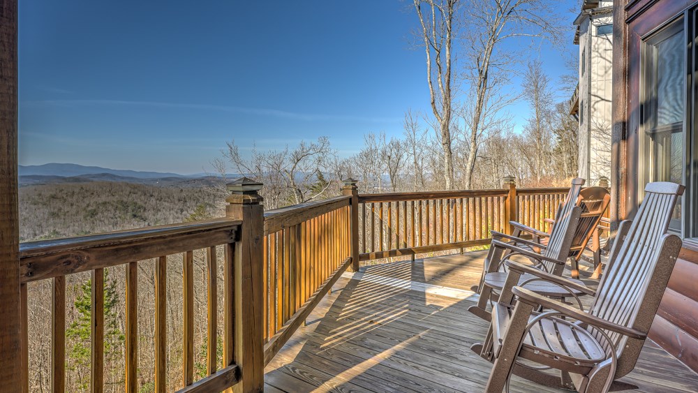 98 Snake Nation Overlook Blue Ridge, GA 30513 - Photo 19 of 41 a view of a balcony with wooden floor and iron fence