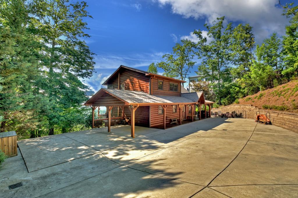 98 Snake Nation Overlook Blue Ridge, GA 30513 - Photo 39 of 41 a view of a house with a large trees and flower plants