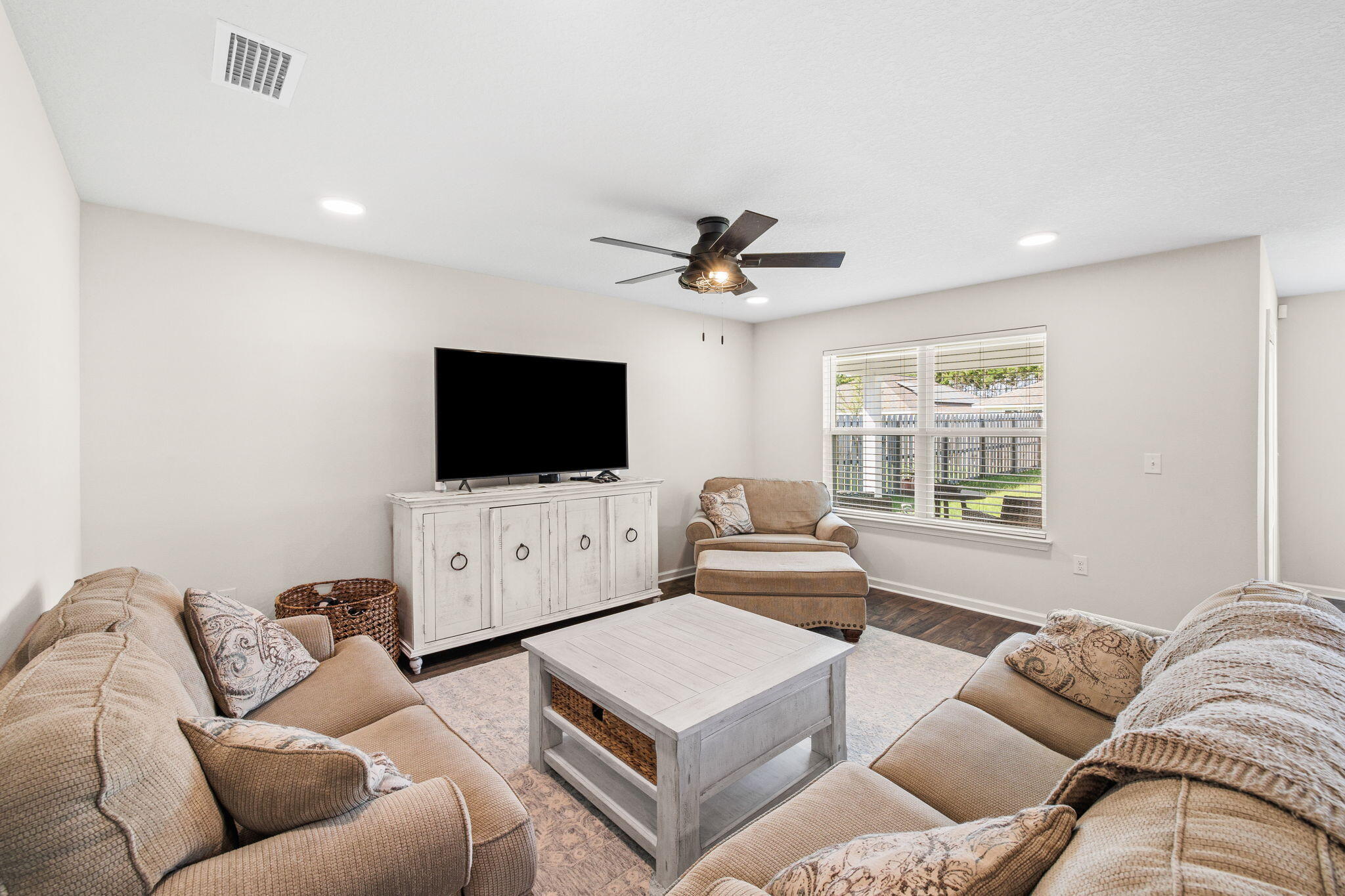 245 This Way Freeport, FL 32439 - Photo 11 of 46 a living room with furniture and a flat screen tv