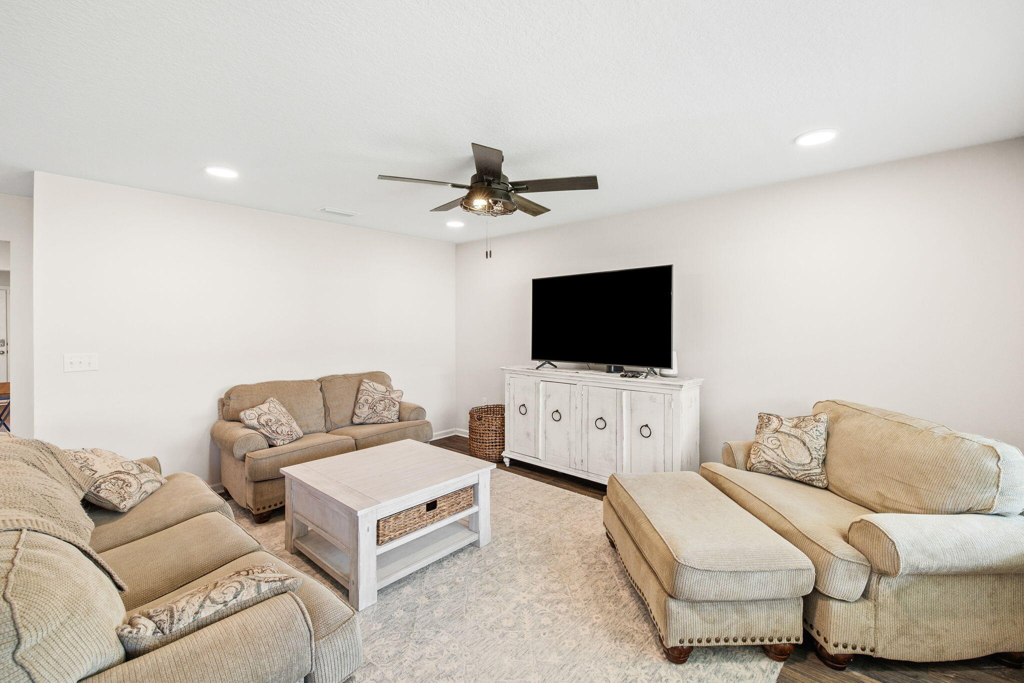245 This Way Freeport, FL 32439 - Photo 12 of 46 a living room with furniture and a flat screen tv