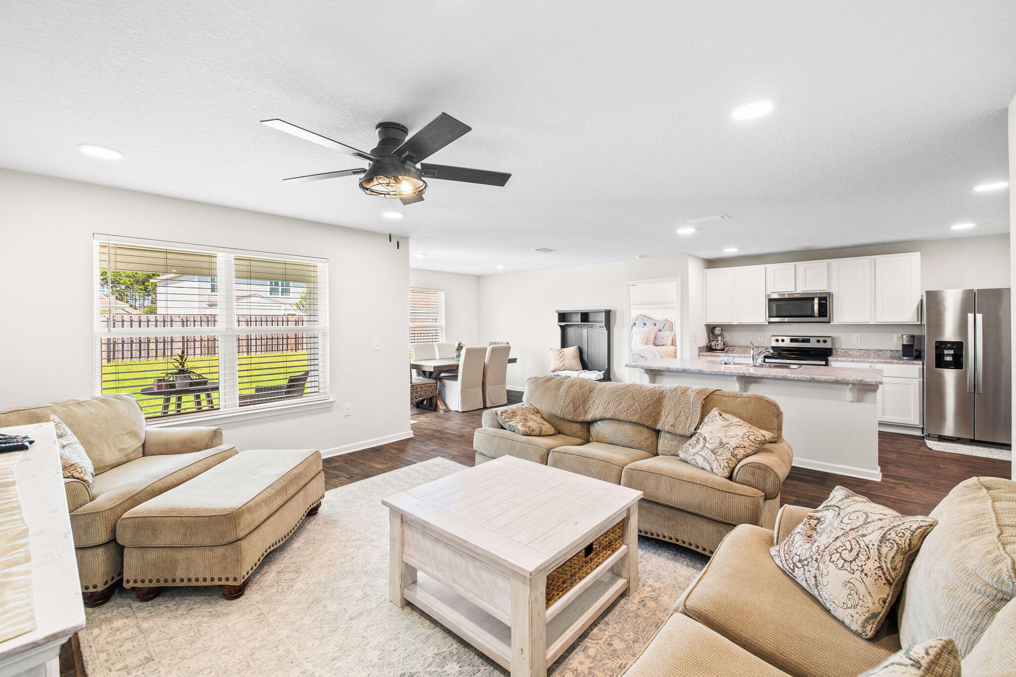 245 This Way Freeport, FL 32439 - Photo 13 of 46 a living room with furniture kitchen view and a large window