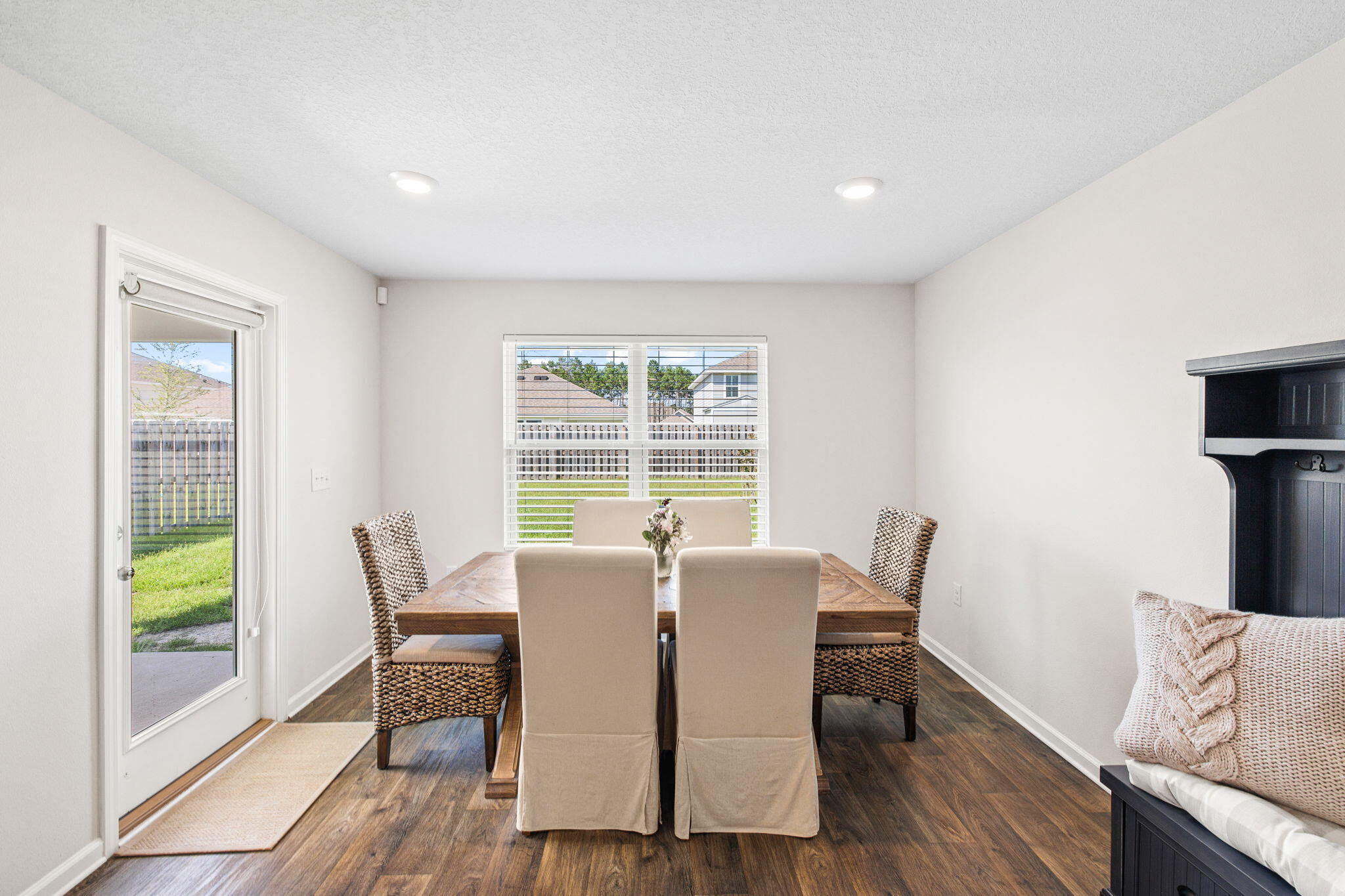245 This Way Freeport, FL 32439 - Photo 14 of 46 a view of a dining room with furniture a rug and wooden floor