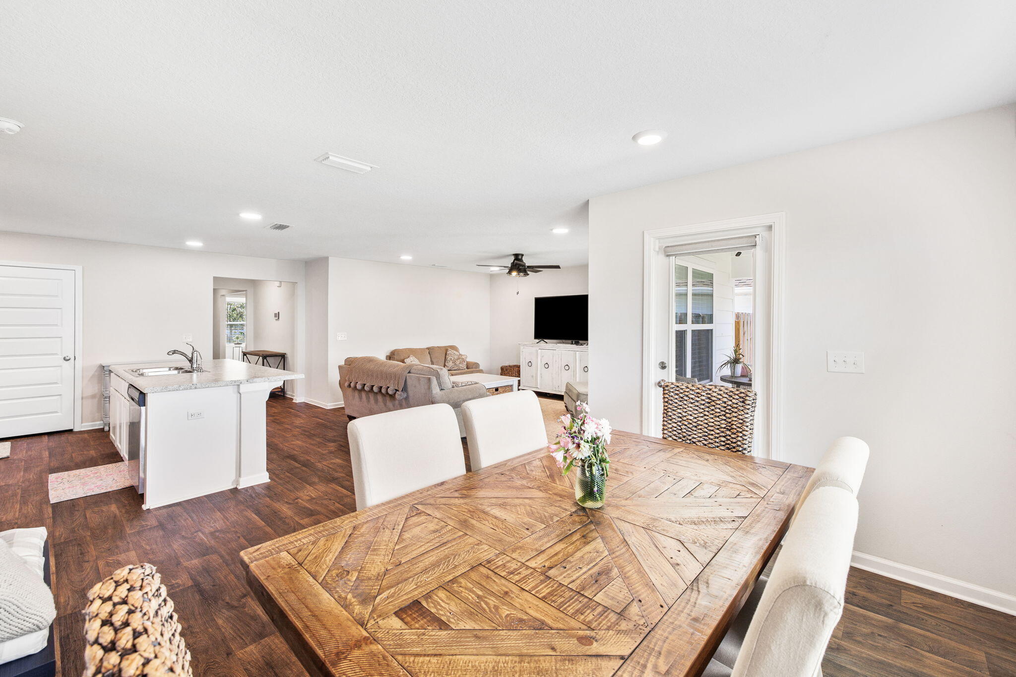 245 This Way Freeport, FL 32439 - Photo 16 of 46 a living room with furniture and a wooden floor