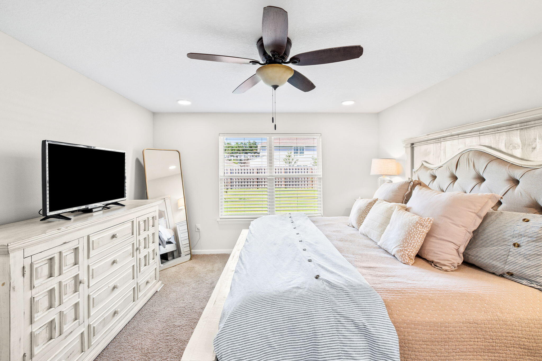 245 This Way Freeport, FL 32439 - Photo 19 of 46 a bedroom with a bed and a flat screen tv