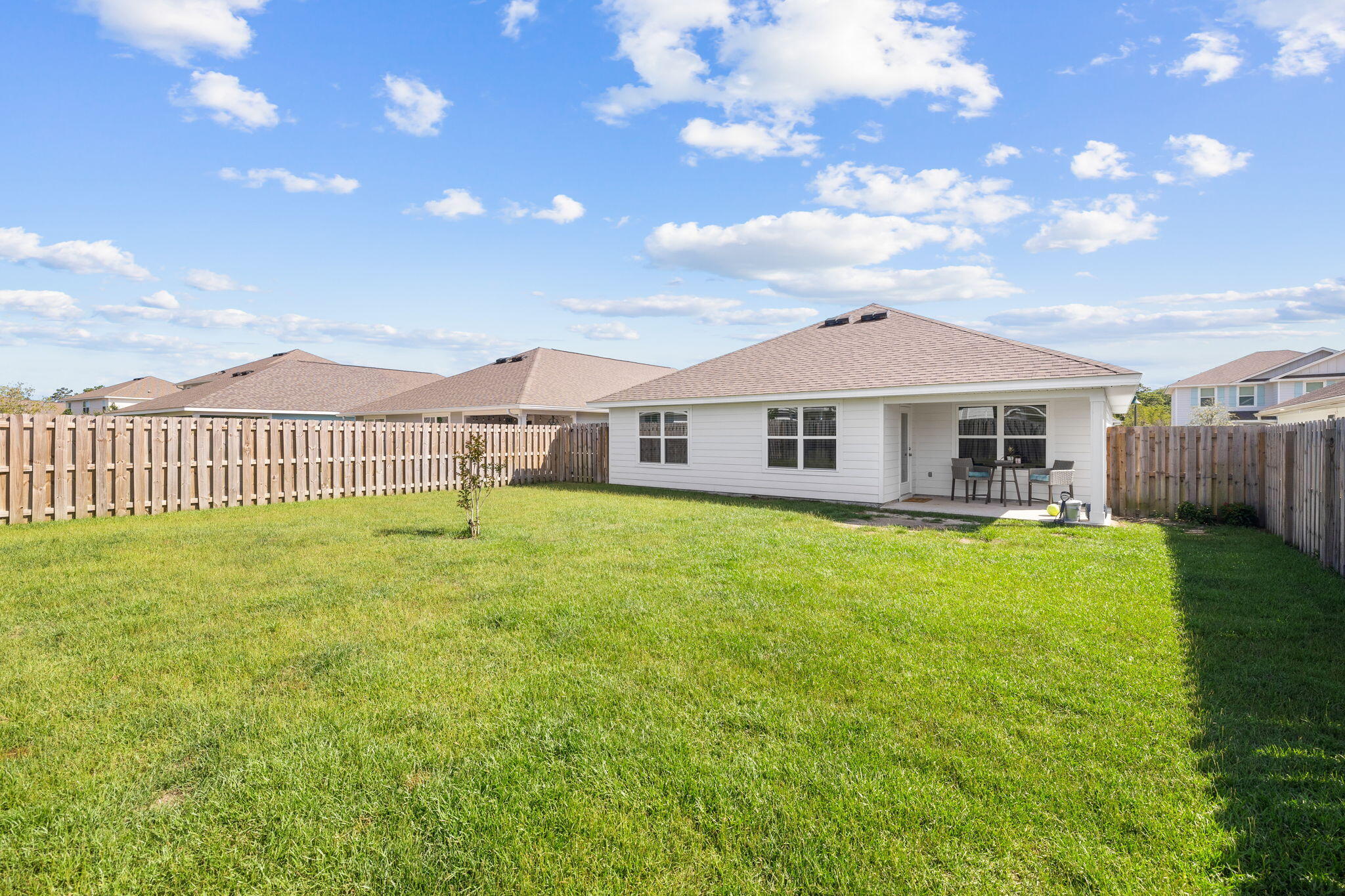 245 This Way Freeport, FL 32439 - Photo 26 of 46 a front view of a house with a garden