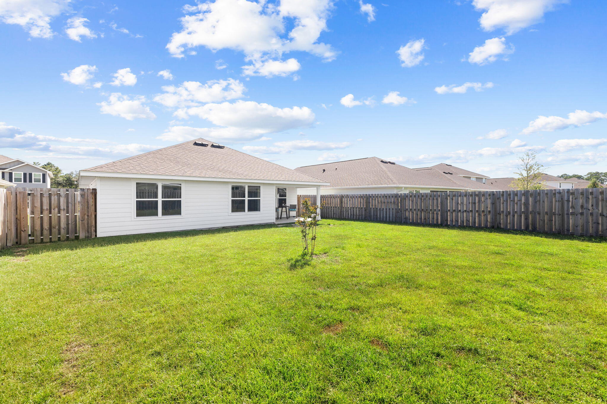245 This Way Freeport, FL 32439 - Photo 28 of 46 a view of an house with backyard and garden