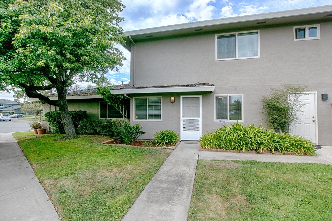 a front view of a house with a yard